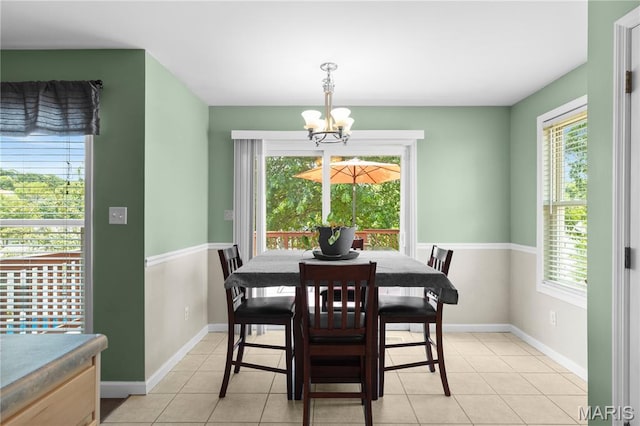 4632 Greenore Dr, High Ridge, MO 63049 - dining area featuring a chandelier and light tile patterned flooring