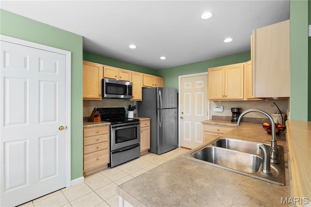 4632 Greenore Dr, High Ridge, MO 63049 - kitchen with appliances with stainless steel finishes, light brown cabinets, light tile patterned floors, recessed lighting, and light countertops