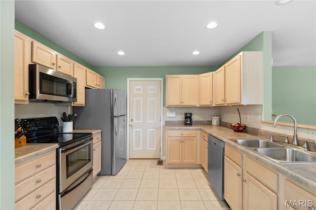 4632 Greenore Dr, High Ridge, MO 63049 - kitchen featuring appliances with stainless steel finishes, light brown cabinets, light tile patterned flooring, light countertops, and recessed lighting