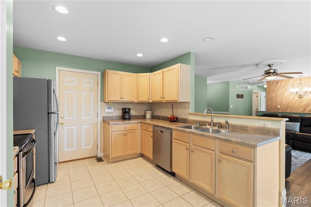4632 Greenore Dr, High Ridge, MO 63049 - kitchen with light brown cabinetry, appliances with stainless steel finishes, a peninsula, a ceiling fan, and recessed lighting