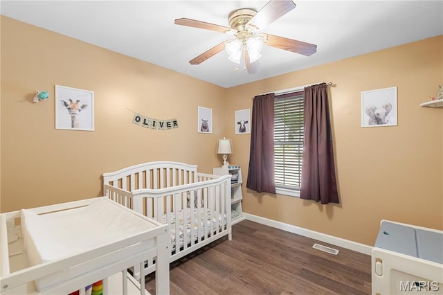 4632 Greenore Dr, High Ridge, MO 63049 - bedroom with wood finished floors, a nursery area, and ceiling fan