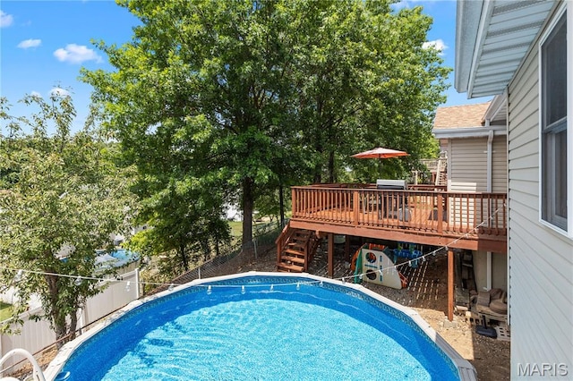 4632 Greenore Dr, High Ridge, MO 63049 - view of pool with a wooden deck, stairs, and a fenced backyard