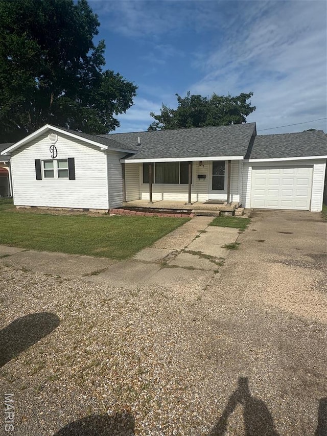 7 N Leota St Unit 7, Dexter, MO 63841 - single story home featuring an attached garage, a porch, driveway, a front yard, and crawl space