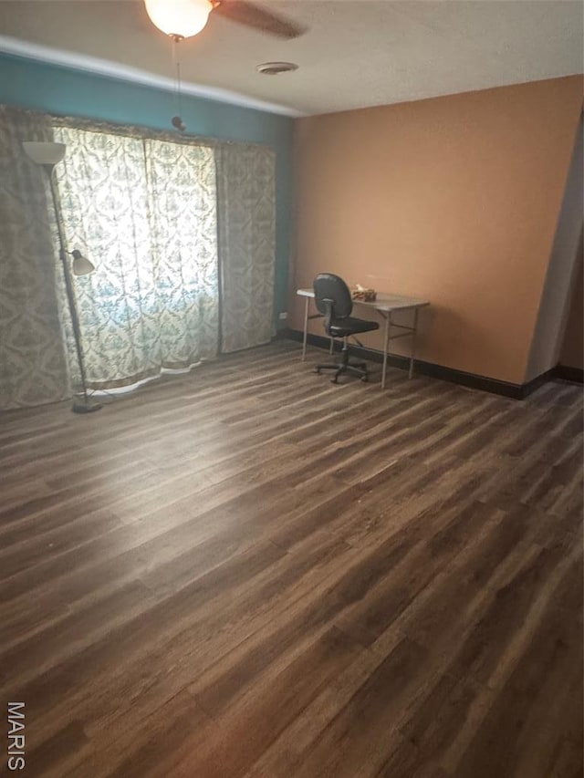 7 N Leota St Unit 7, Dexter, MO 63841 - unfurnished office featuring dark wood-style floors and baseboards