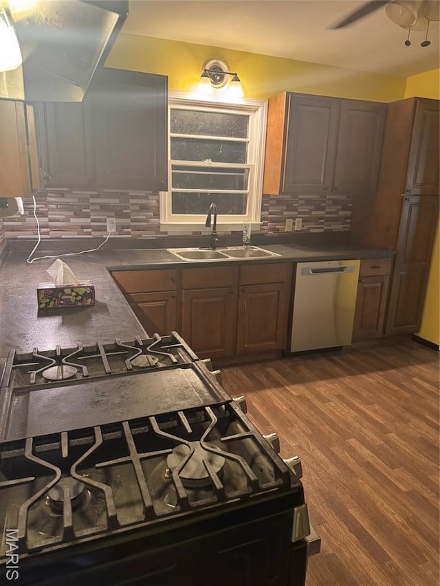 7 N Leota St Unit 7, Dexter, MO 63841 - kitchen featuring dishwasher, range hood, backsplash, dark countertops, and ceiling fan