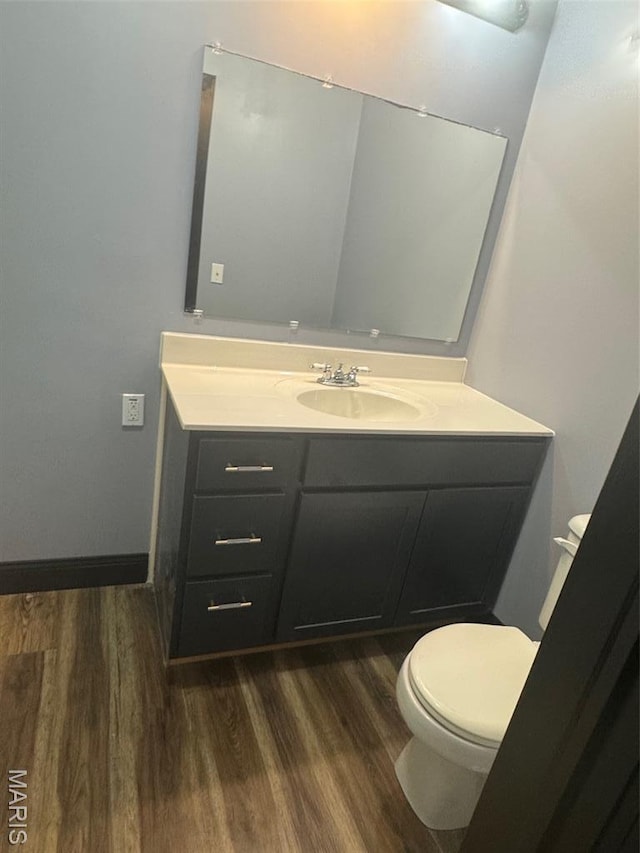 7 N Leota St Unit 7, Dexter, MO 63841 - bathroom featuring vanity and wood finished floors