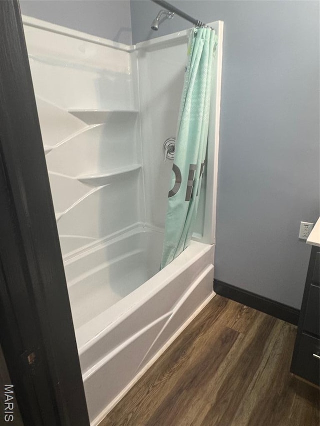 7 N Leota St Unit 7, Dexter, MO 63841 - full bathroom with shower / tub combo, wood finished floors, and vanity