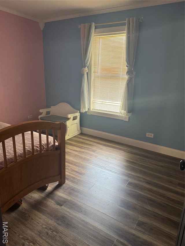 7 N Leota St Unit 7, Dexter, MO 63841 - bedroom featuring wood finished floors and crown molding