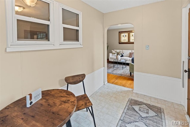 25 S 77th St, Belleville, IL 62223 - hall featuring arched walkways, wainscoting, and light tile patterned flooring
