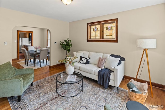 25 S 77th St, Belleville, IL 62223 - living room featuring arched walkways and wood finished floors