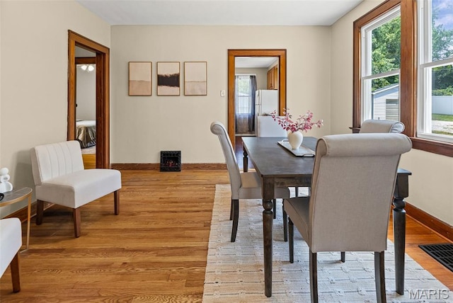 25 S 77th St, Belleville, IL 62223 - dining space featuring light wood-style flooring and plenty of natural light