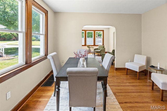 25 S 77th St, Belleville, IL 62223 - dining room featuring arched walkways and light wood-type flooring