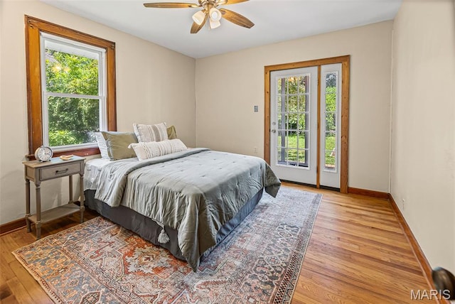 25 S 77th St, Belleville, IL 62223 - bedroom with access to exterior, light wood-type flooring, and a ceiling fan