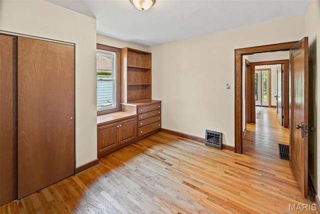 25 S 77th St, Belleville, IL 62223 - unfurnished bedroom with light wood-style floors and a closet