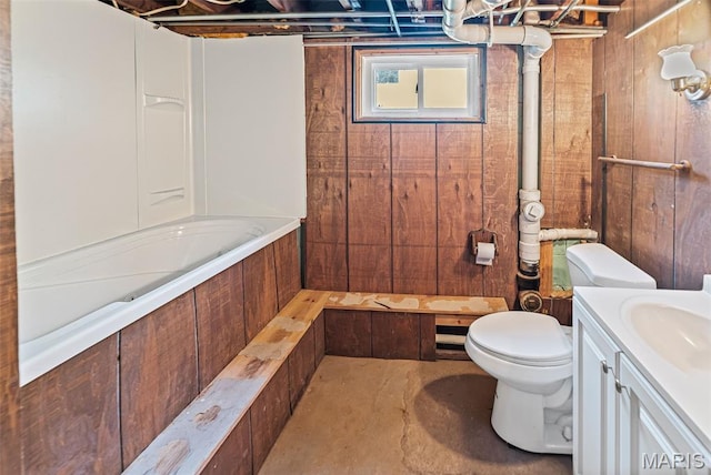 25 S 77th St, Belleville, IL 62223 - full bath with vanity, wooden walls, concrete flooring, and bathing tub / shower combination