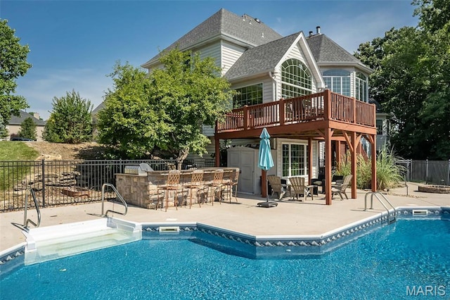 2314 Longest Dr, Wentzville, MO 63385 - view of swimming pool with a wooden deck and a patio