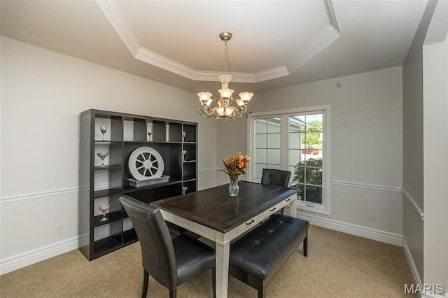 2314 Longest Dr, Wentzville, MO 63385 - dining room featuring a tray ceiling, a chandelier, light carpet, and crown molding
