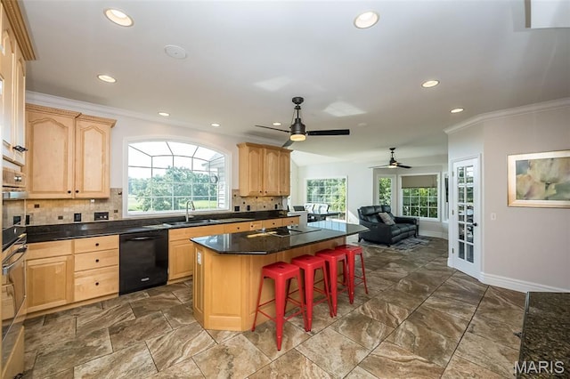 2314 Longest Dr, Wentzville, MO 63385 - kitchen featuring black dishwasher, light brown cabinets, a center island, ornamental molding, and a breakfast bar