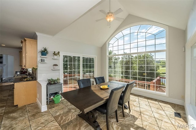 2314 Longest Dr, Wentzville, MO 63385 - dining room with ceiling fan, stone tile flooring, and high vaulted ceiling