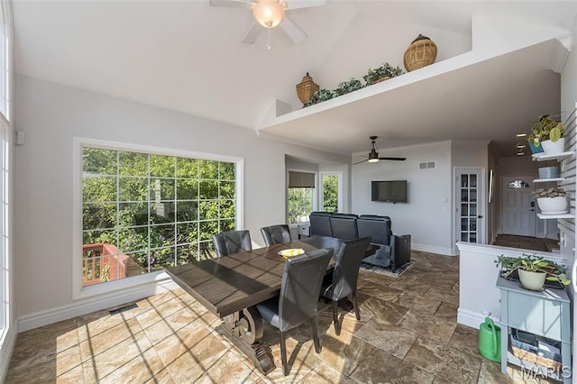 2314 Longest Dr, Wentzville, MO 63385 - dining space featuring ceiling fan, stone tile floors, and high vaulted ceiling