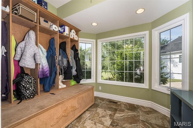 2314 Longest Dr, Wentzville, MO 63385 - mudroom with healthy amount of natural light and stone finish floors