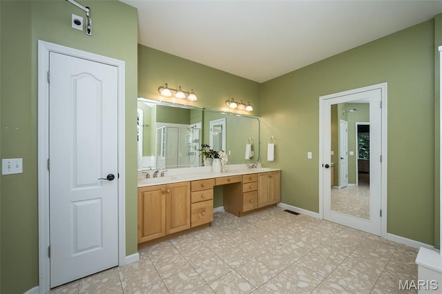 2314 Longest Dr, Wentzville, MO 63385 - bathroom with double vanity and an enclosed shower