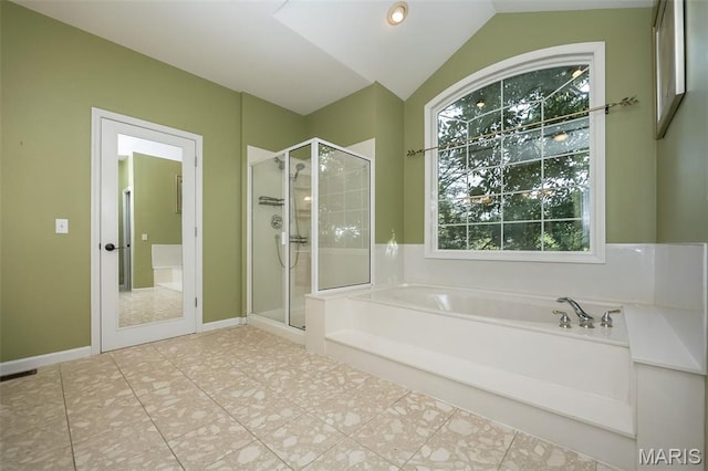 2314 Longest Dr, Wentzville, MO 63385 - full bathroom featuring a bath, a stall shower, vaulted ceiling, and tile patterned flooring