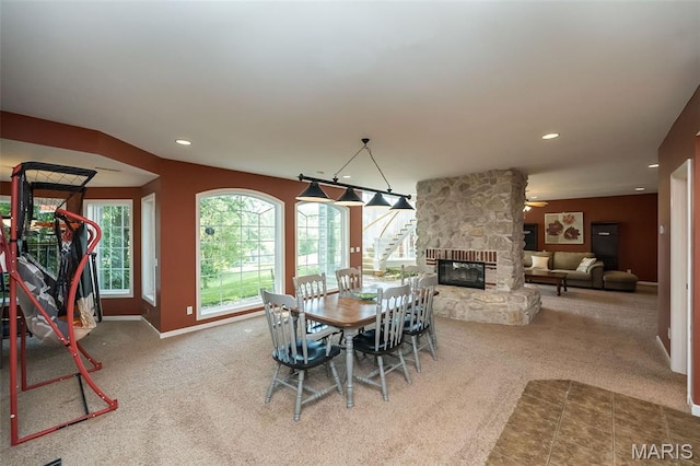 2314 Longest Dr, Wentzville, MO 63385 - carpeted dining room featuring recessed lighting, a fireplace, and a ceiling fan