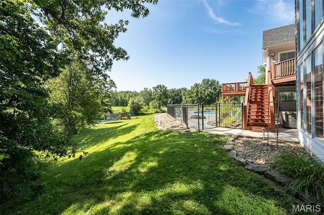 2314 Longest Dr, Wentzville, MO 63385 - view of yard with stairway, a deck, a community pool, and a patio area