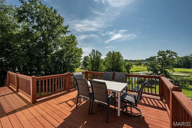 2314 Longest Dr, Wentzville, MO 63385 - wooden deck with a water view, outdoor dining space, and view of wooded area