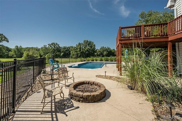 2314 Longest Dr, Wentzville, MO 63385 - community pool featuring an outdoor fire pit, a patio area, a deck, and view of scattered trees