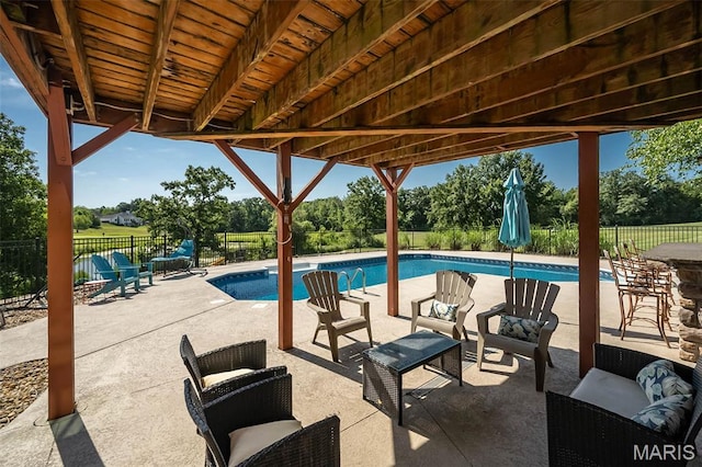 2314 Longest Dr, Wentzville, MO 63385 - view of swimming pool with a fenced backyard, a patio area, and view of wooded area