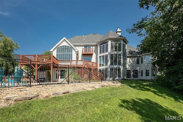 2314 Longest Dr, Wentzville, MO 63385 - rear view of property featuring stairway, a deck, a lawn, a chimney, and a patio