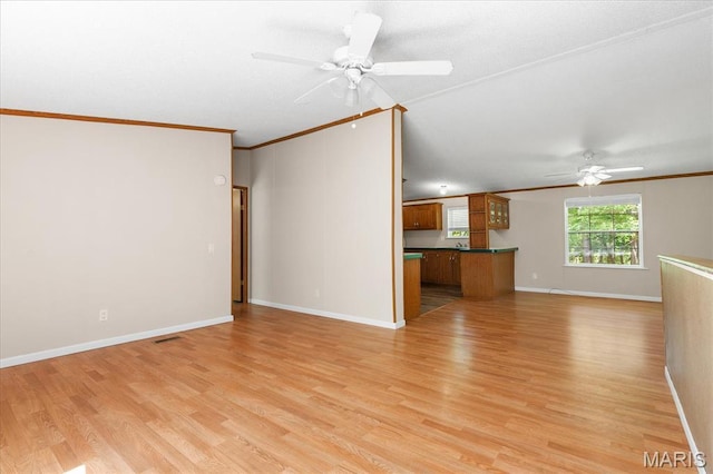 434 Cool Springs Ln, Wright City, MO 63390 - unfurnished living room featuring a ceiling fan, crown molding, and light wood-type flooring