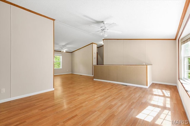 434 Cool Springs Ln, Wright City, MO 63390 - spare room featuring a ceiling fan, crown molding, light wood-style floors, and vaulted ceiling