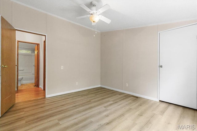 434 Cool Springs Ln, Wright City, MO 63390 - unfurnished bedroom with crown molding, light wood-style floors, a ceiling fan, and connected bathroom