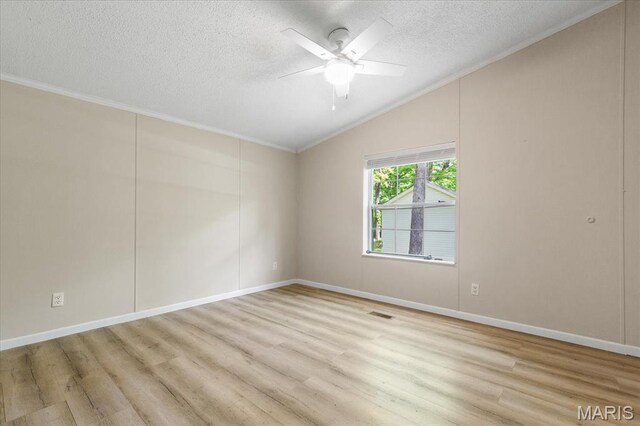 434 Cool Springs Ln, Wright City, MO 63390 - spare room featuring lofted ceiling, crown molding, light wood finished floors, a textured ceiling, and ceiling fan