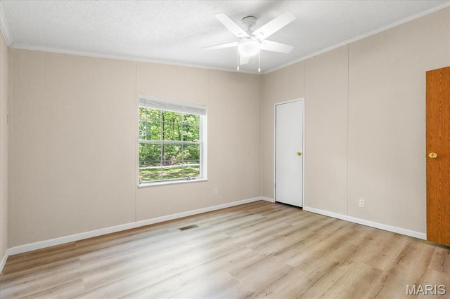 434 Cool Springs Ln, Wright City, MO 63390 - empty room featuring crown molding, wood finished floors, ceiling fan, and a textured ceiling
