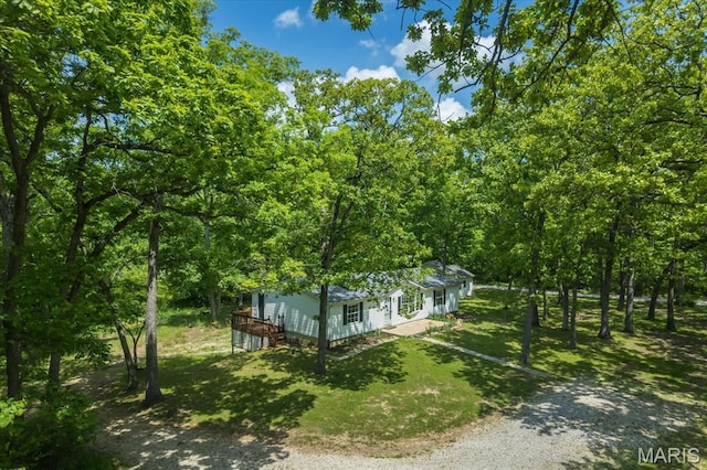 434 Cool Springs Ln, Wright City, MO 63390 - view of front of property with a front lawn, driveway, a wooded view, and a wooden deck