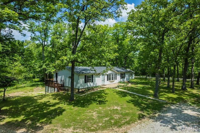 434 Cool Springs Ln, Wright City, MO 63390 - view of front of property featuring a front lawn, driveway, a wooden deck, and roof with shingles