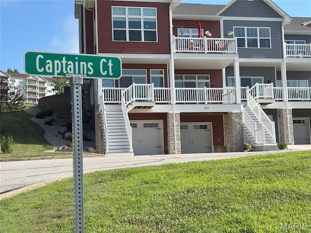 314 Captains Ct, Grafton, IL 62037 - view of building exterior featuring stairs and an attached garage