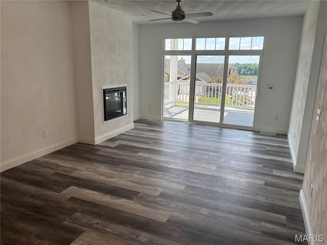 314 Captains Ct, Grafton, IL 62037 - unfurnished living room featuring a ceiling fan, dark wood-style floors, and a glass covered fireplace
