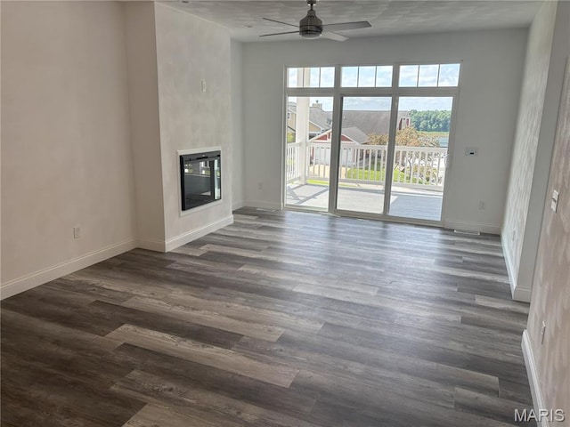 314 Captains Ct, Grafton, IL 62037 - unfurnished living room featuring a ceiling fan, dark wood-style floors, and a glass covered fireplace