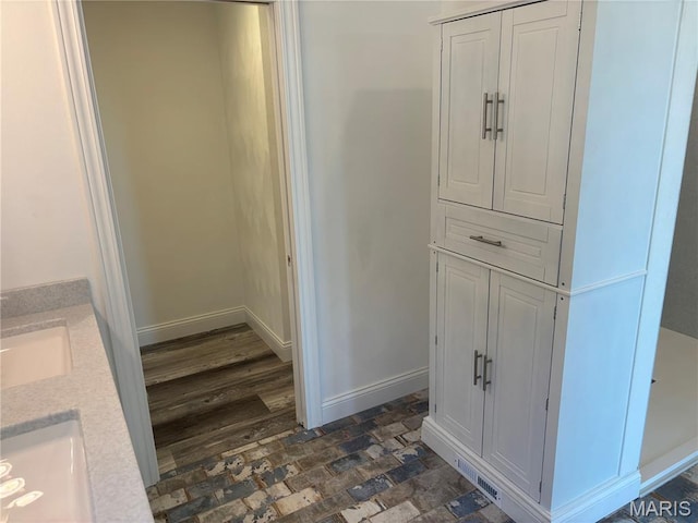 314 Captains Ct, Grafton, IL 62037 - bathroom with double vanity and baseboards