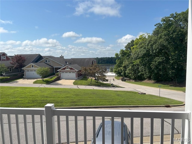 314 Captains Ct, Grafton, IL 62037 - view of front of house with concrete driveway, a front yard, and a garage