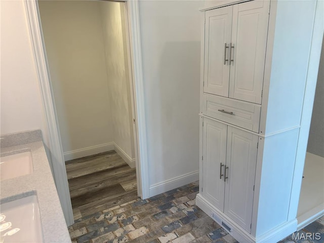 314 Captains Ct, Grafton, IL 62037 - bathroom with double vanity and baseboards