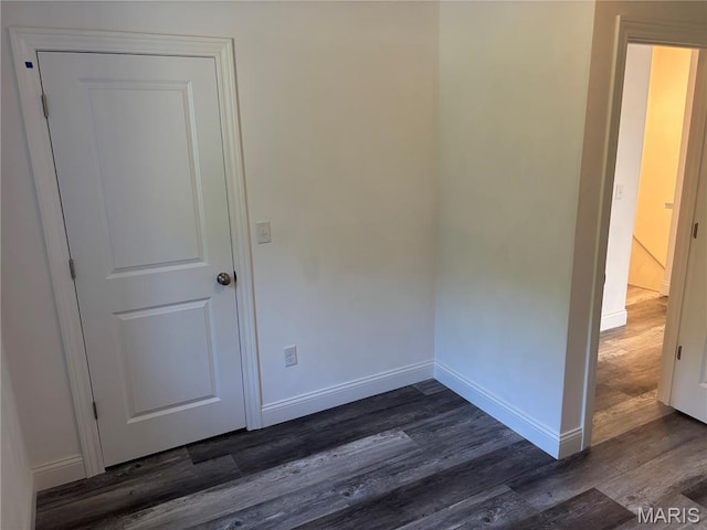 314 Captains Ct, Grafton, IL 62037 - empty room with dark wood finished floors and baseboards