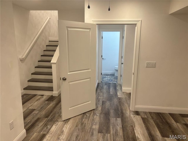 314 Captains Ct, Grafton, IL 62037 - hall featuring dark wood-type flooring and stairs