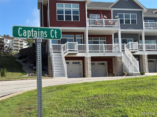314 Captains Ct, Grafton, IL 62037 - view of property featuring stairs and a garage