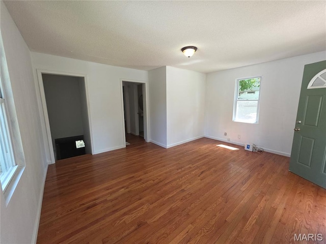 123 W Wickliffe Ave, Collinsville, IL 62234 - empty room featuring wood finished floors and a textured ceiling